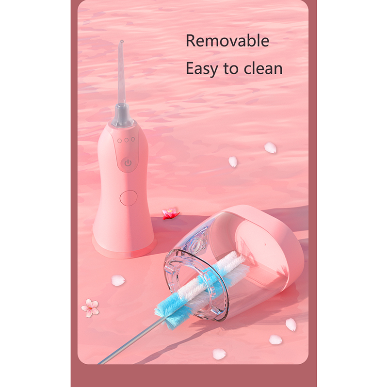 What does an oral irrigator do ?